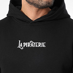 Hoodie Les Voix Navigables – La Piraterie – broderie poitrine et sérigraphie dos, coupe droite streetwear premium