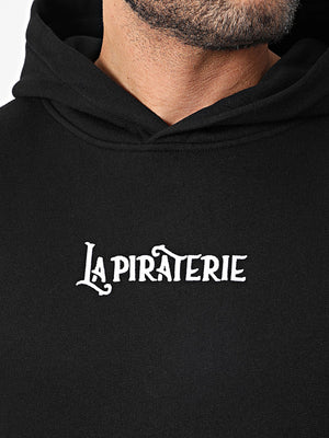 Hoodie Les Voix Navigables – La Piraterie – broderie poitrine et sérigraphie dos, coupe droite streetwear premium